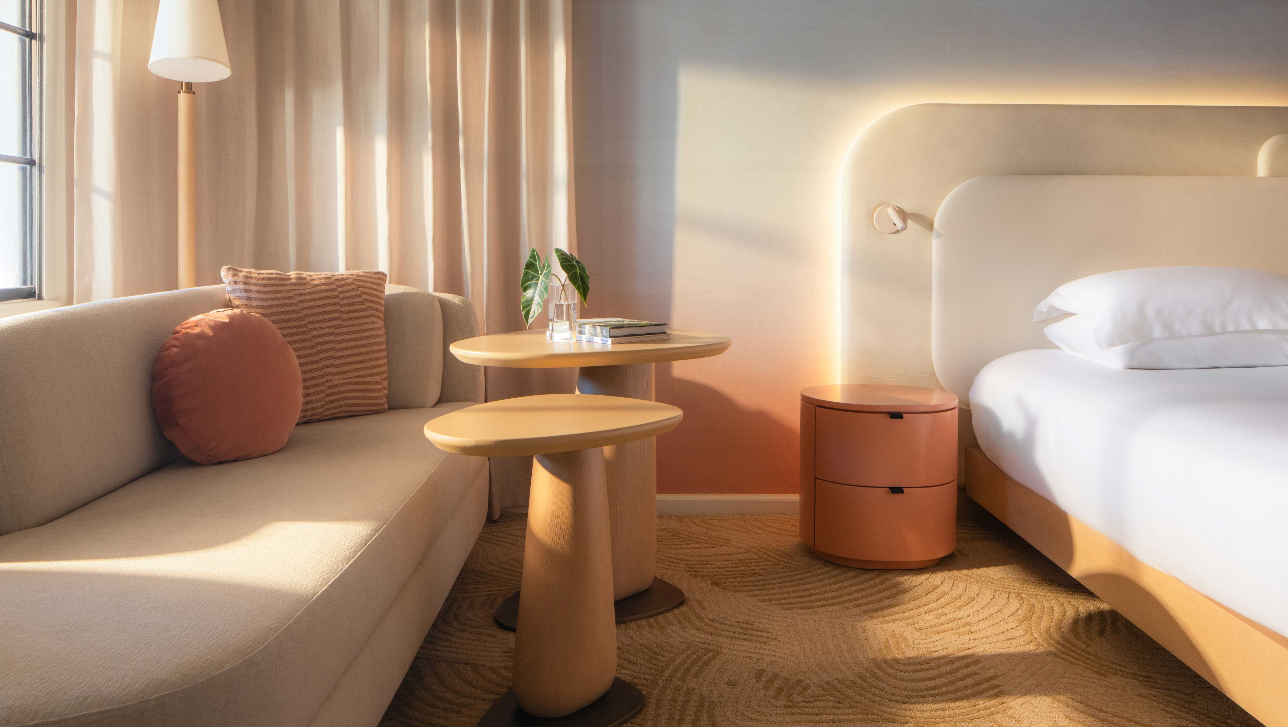 bed, side table and couch in Miralina Guestroom