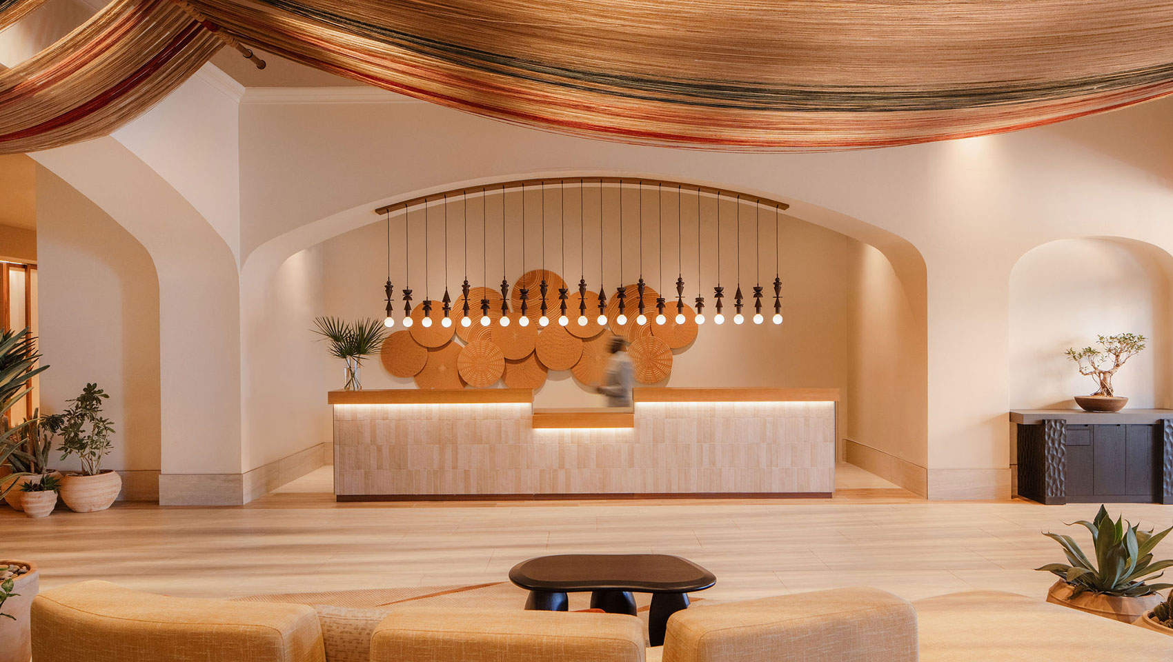 Lobby seating area at Kimpton Miralina with warm tones and contemporary desert textures