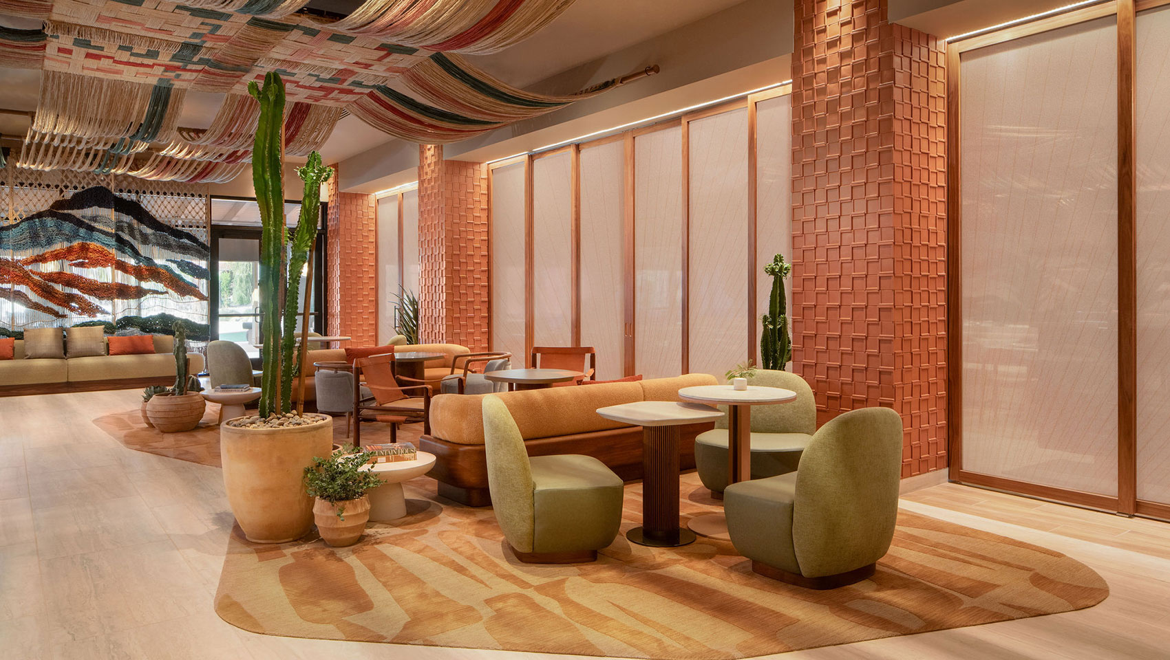 Kimpton Miralina café, bar, and lounge with modern seating and warm, inviting lighting