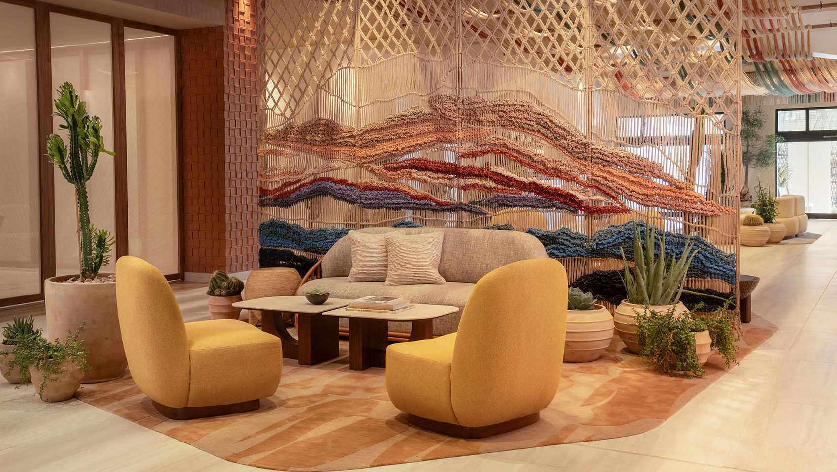 Lobby seating area at Kimpton Miralina with warm tones and contemporary desert textures