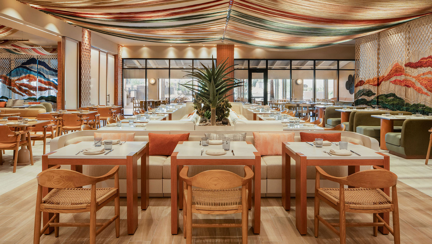 Hecho Libre interior at Kimpton Miralina with handcrafted décor and a cozy dining atmosphere