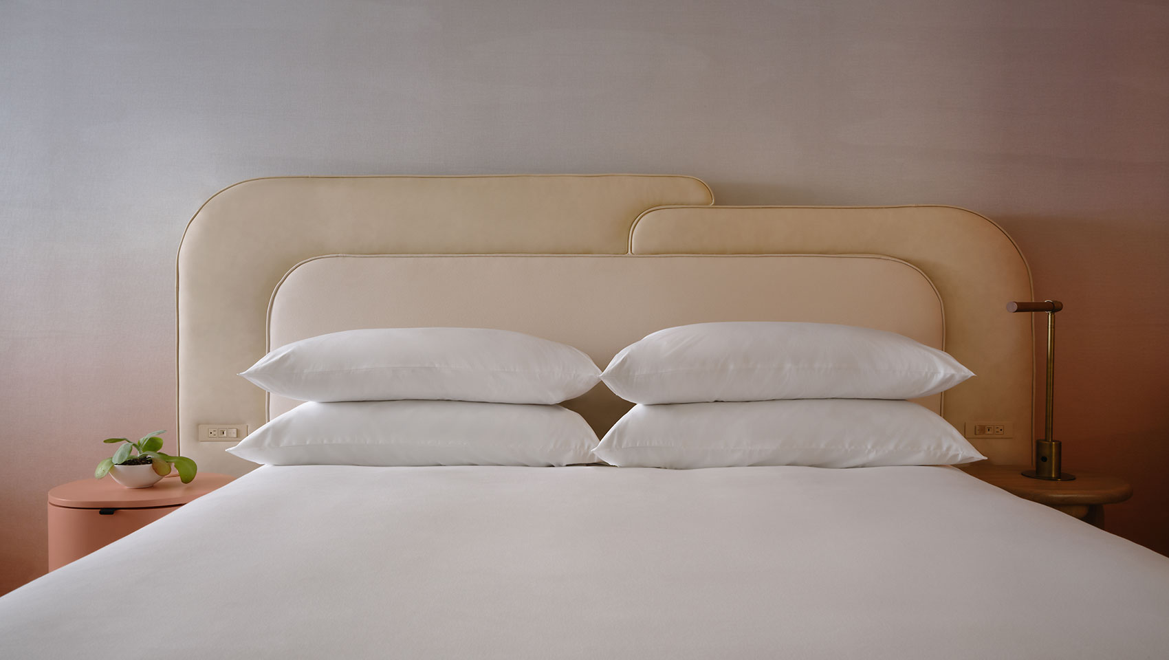 King bed with framing light at Kimpton Miralina