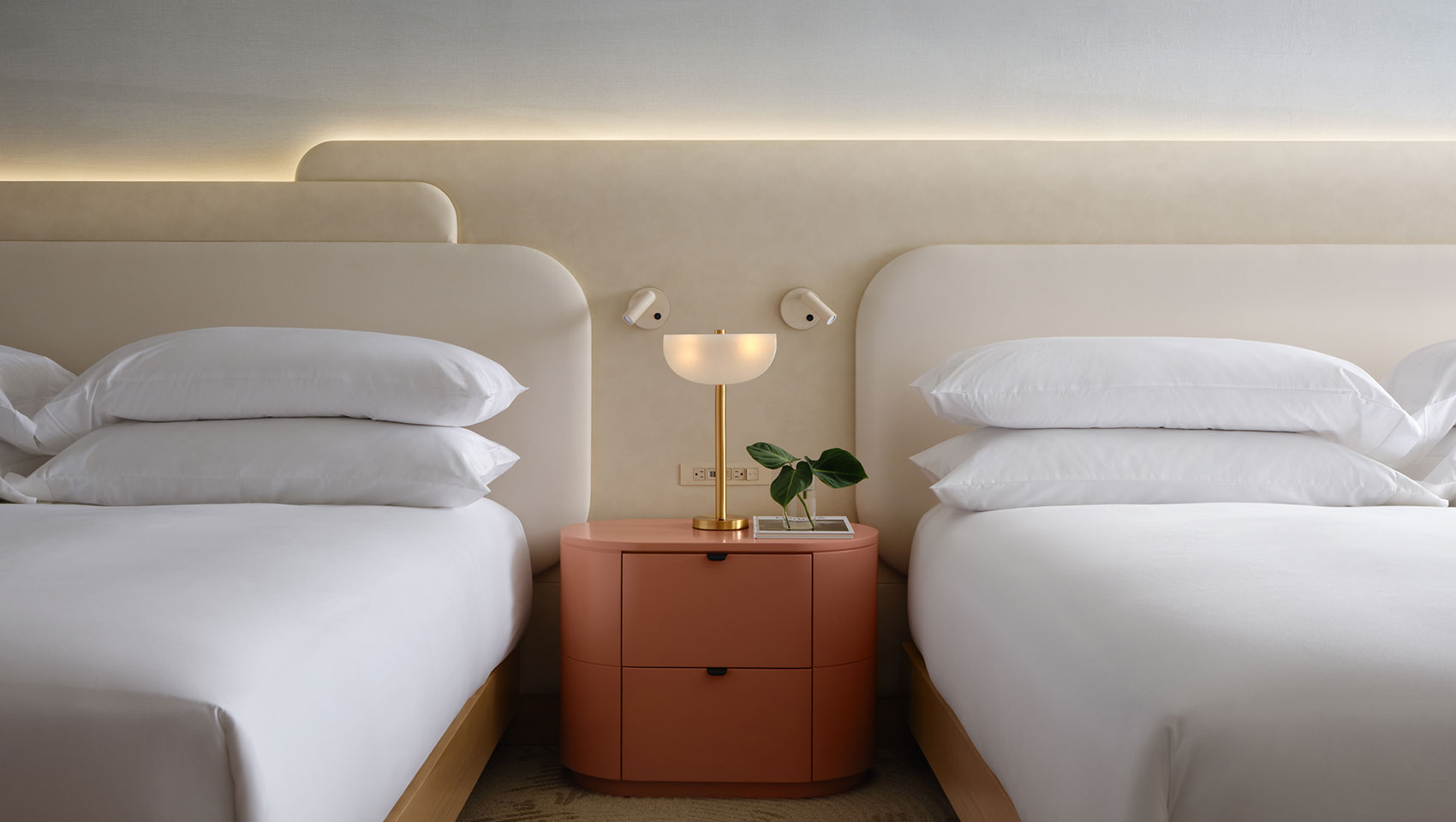 Two Queen beds with shared side table at Kimpton Miralina