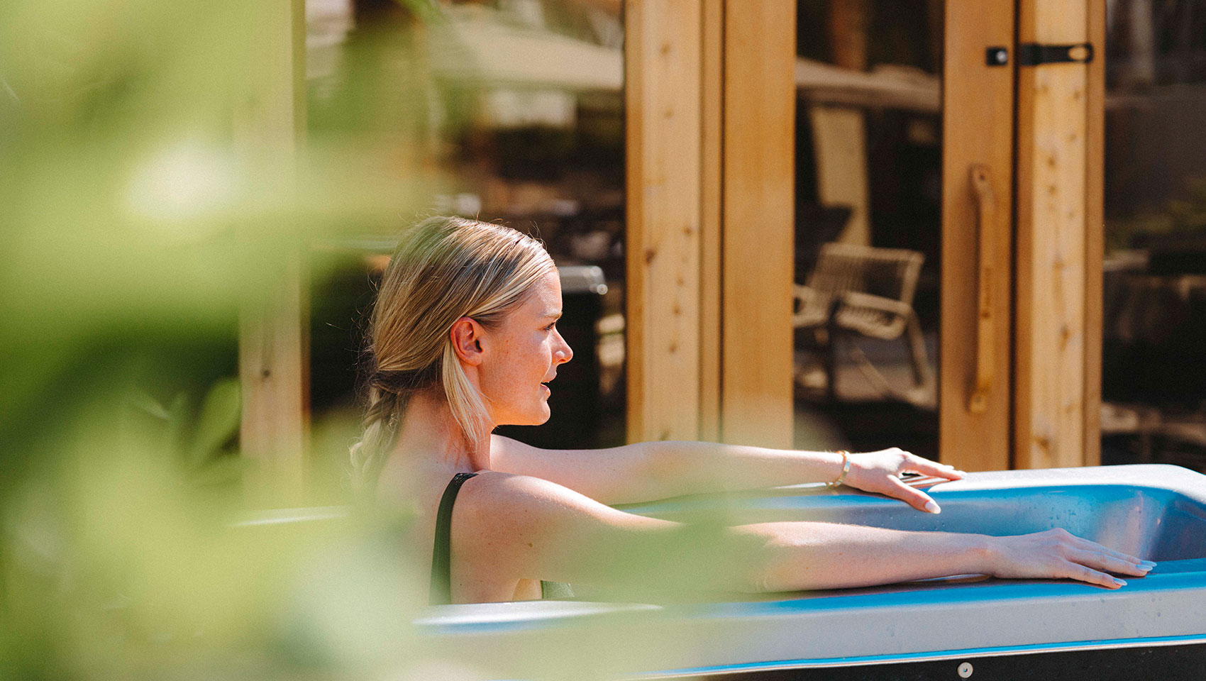 Woman in cold plunge at Kimpton Miralina