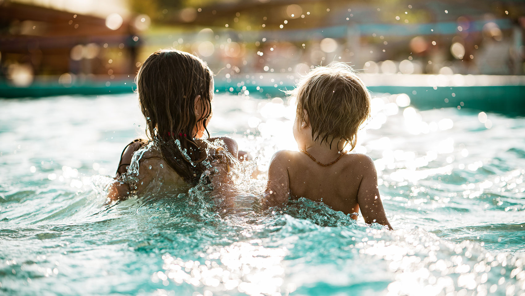 Swimming pool with children playing