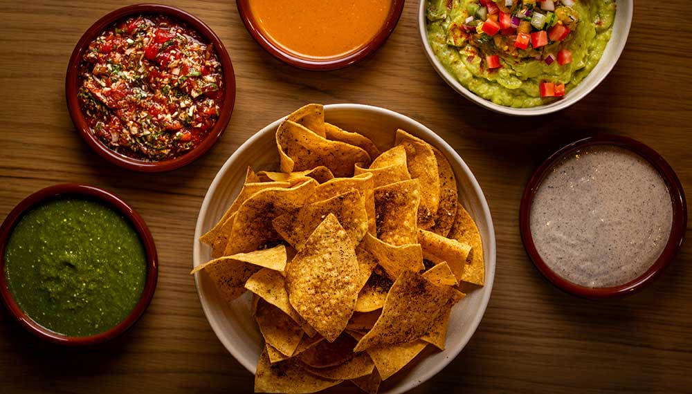 Tortilla chips and assorted dips