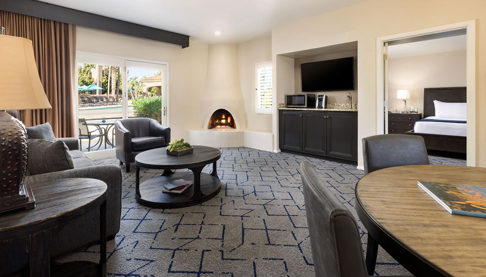 Miralina villa living room with fireplace and courtyard view
