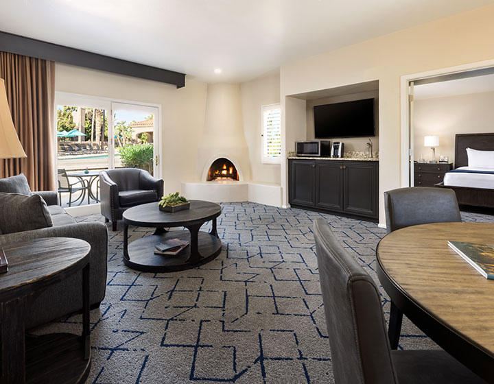 Miralina villa living room with fireplace and courtyard view