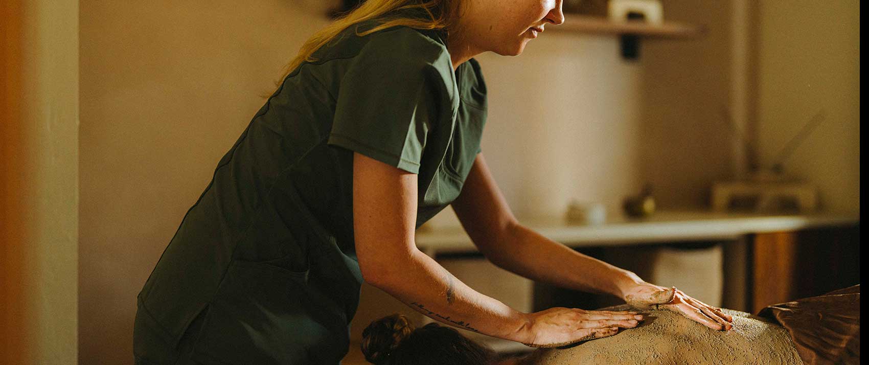 woman gives massage at the spa at Kimpton Miralina Resort